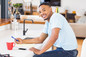 Young man paying bills